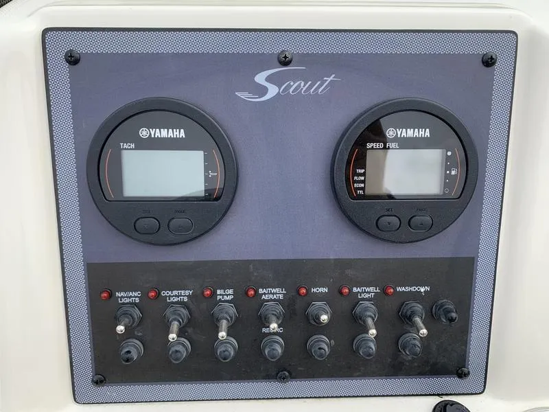 Slide: The Image of Control panel of 2025 Scout 175 Sportfish boat with Yamaha gauges and switches. - 13
