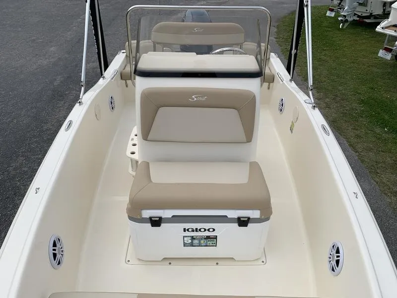 Slide: The Image of 2025 Scout 175 Sportfish boat interior with seating and Igloo cooler. - 18