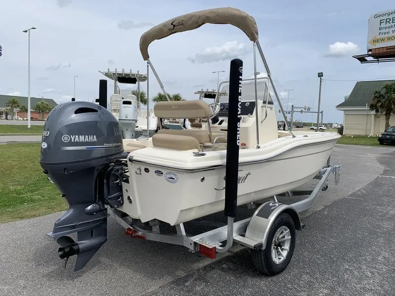 Slide: The Image of 2025 Scout 175 Sportfish boat with Yamaha outboard motor on a trailer. - 3