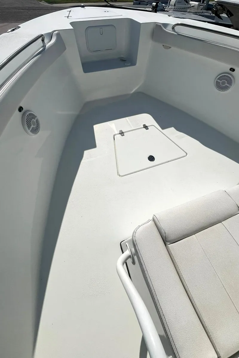 Slide: The Image of 2018 Clearwater 2508 boat interior with seating and storage compartments. - 10