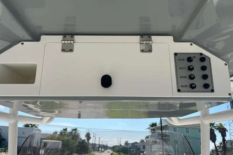 Slide: The Image of Clearwater 2508 boat console with control panel, 2018 model, outdoor view. - 4