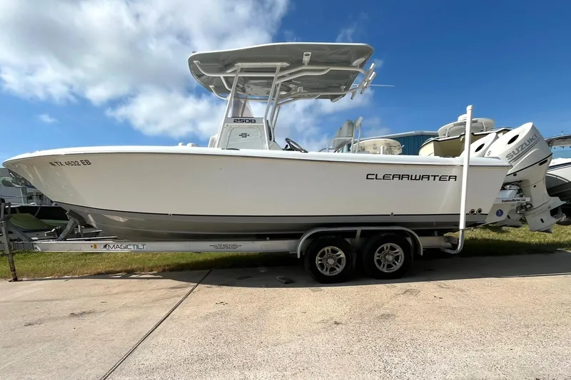 The Image of 2018 Clearwater 2508 boat on trailer under blue sky. - 0