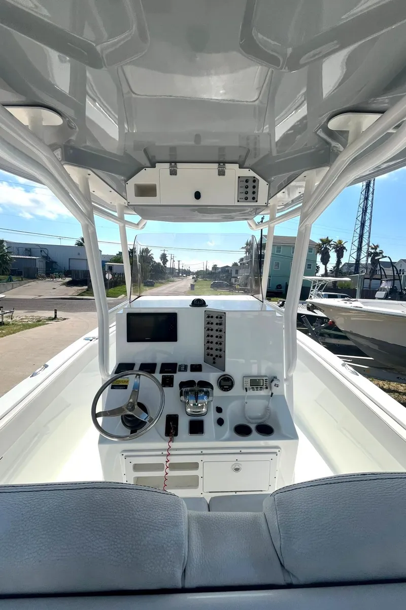 Slide: The Image of 2018 Clearwater 2508 boat interior with steering wheel and control panel. - 3