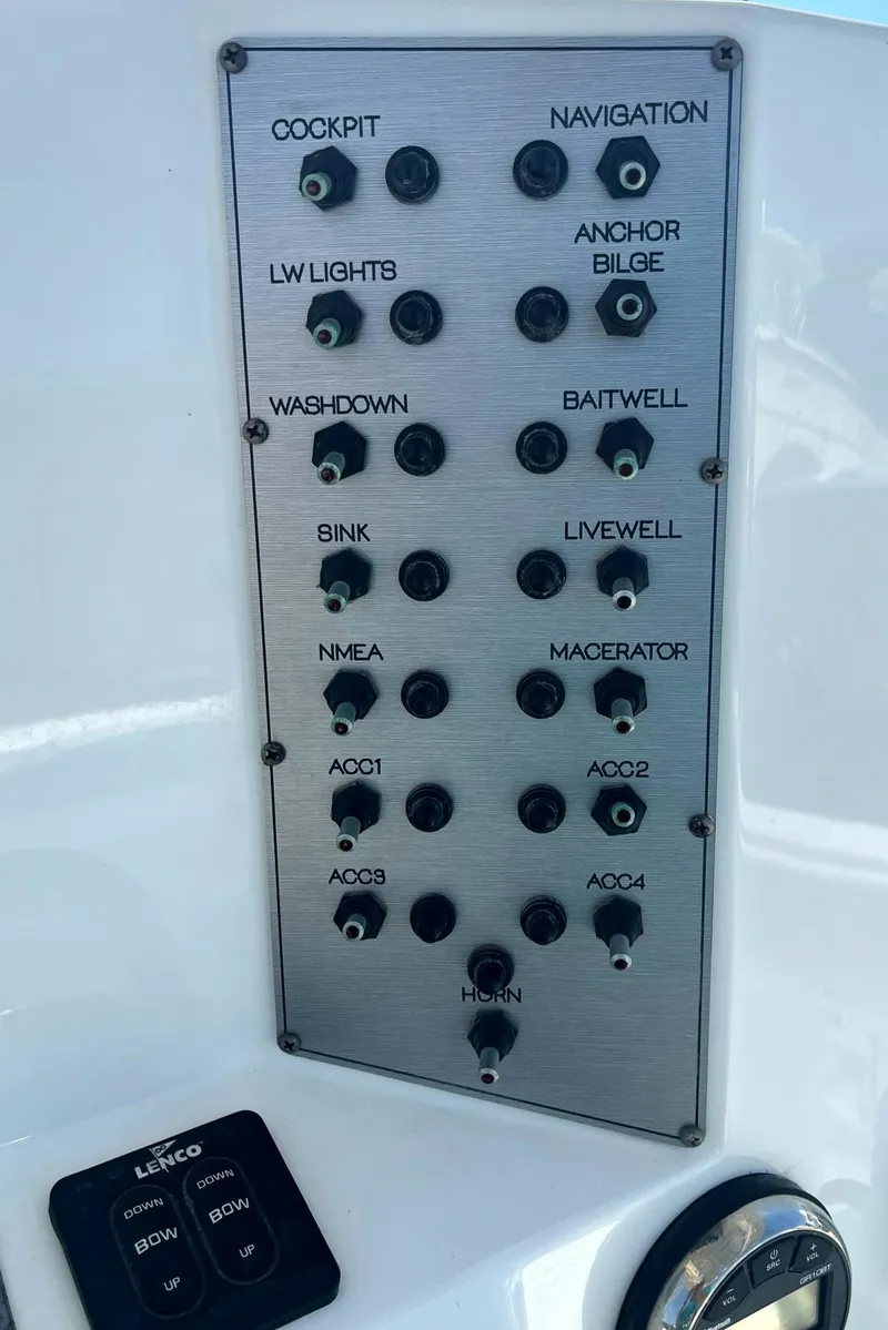 Slide: The Image of Control panel of a 2018 Clearwater 2508 boat with labeled switches. - 5