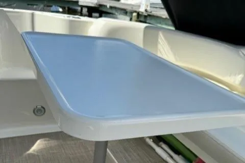 Slide: The Image of Interior table on 2002 Sea Ray 410 Sundancer yacht. - 17