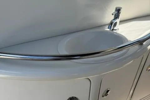 Slide: The Image of 2002 Sea Ray 410 Sundancer yacht bathroom sink with chrome faucet. - 18
