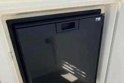 Slide: The Image of Compact black refrigerator on 2002 Sea Ray 410 Sundancer yacht. - 21