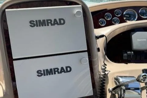 Slide: The Image of Simrad navigation equipment on 2002 Sea Ray 410 Sundancer boat dashboard. - 25