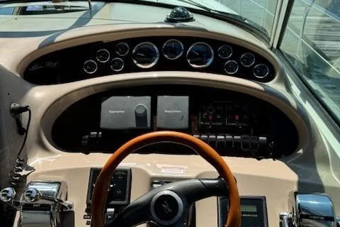 Slide: The Image of Dashboard of 2002 Sea Ray 410 Sundancer with gauges and controls. - 29