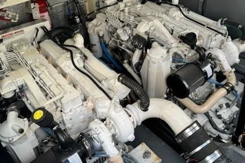 Slide: The Image of Twin engines of a 2002 Sea Ray 410 Sundancer yacht. - 30