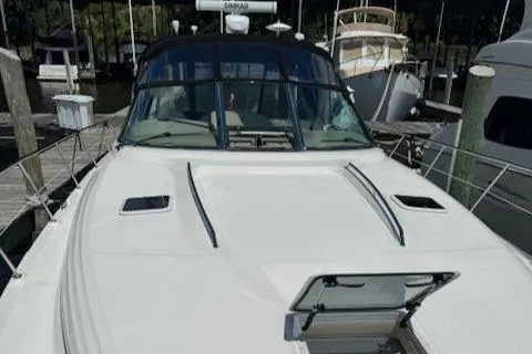 Slide: The Image of 2002 Sea Ray 410 Sundancer yacht docked at marina. - 8