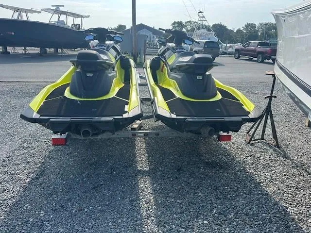 Slide: The Image of 2021 Yamaha WaveRunner VX Limited jet skis on a trailer in a marina. - 4