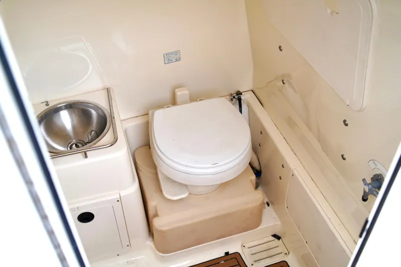 Slide: The Image of 2009 Scout 282 Sportfish boat bathroom with sink and toilet. - 20