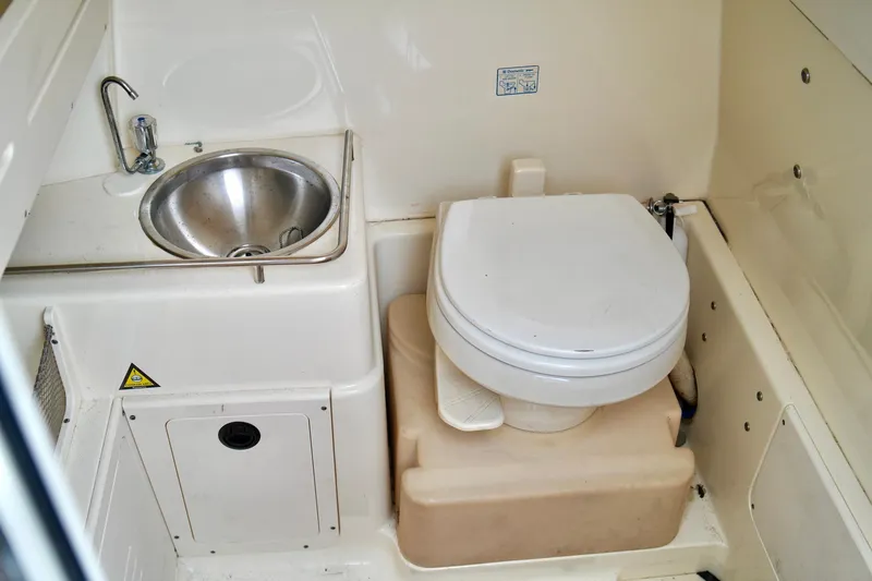 Slide: The Image of 2009 Scout 282 Sportfish boat bathroom with sink and toilet. - 21