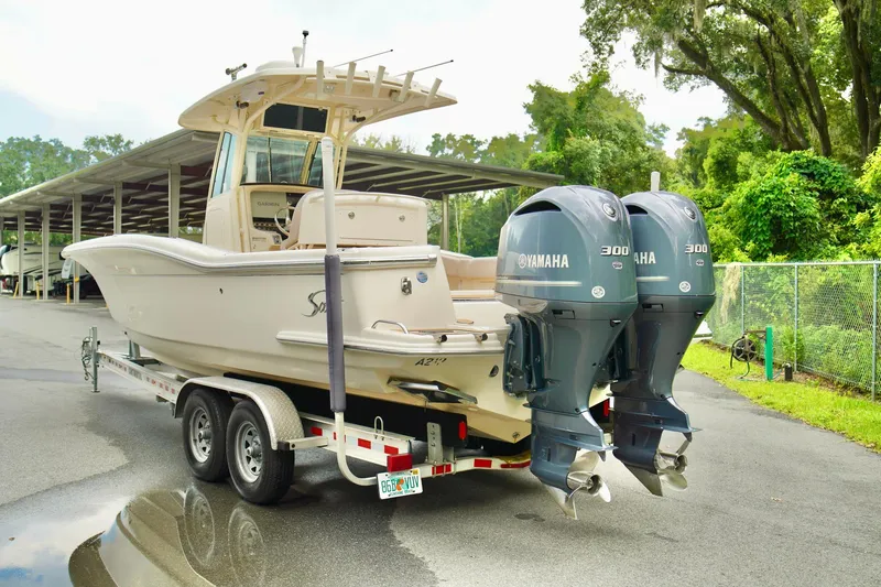 Slide: The Image of 2009 Scout 282 Sportfish boat on trailer with twin Yamaha 300 engines. - 25