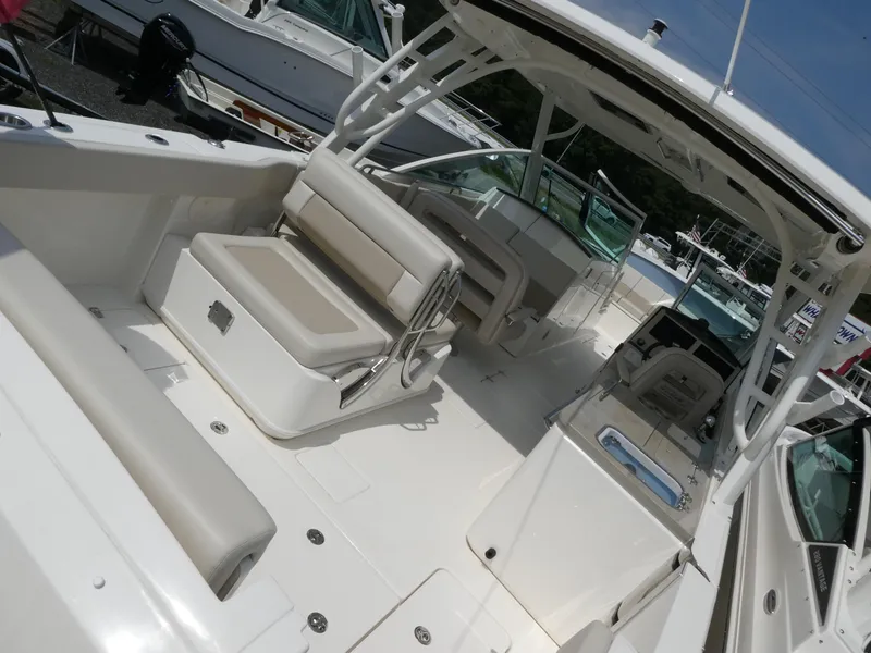 Slide: The Image of 2024 Boston Whaler 320 Vantage boat interior with seating and helm. - 3