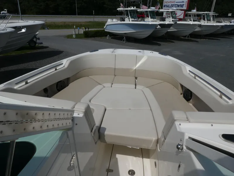 Slide: The Image of 2024 Boston Whaler 320 Vantage boat interior with spacious seating area. - 9
