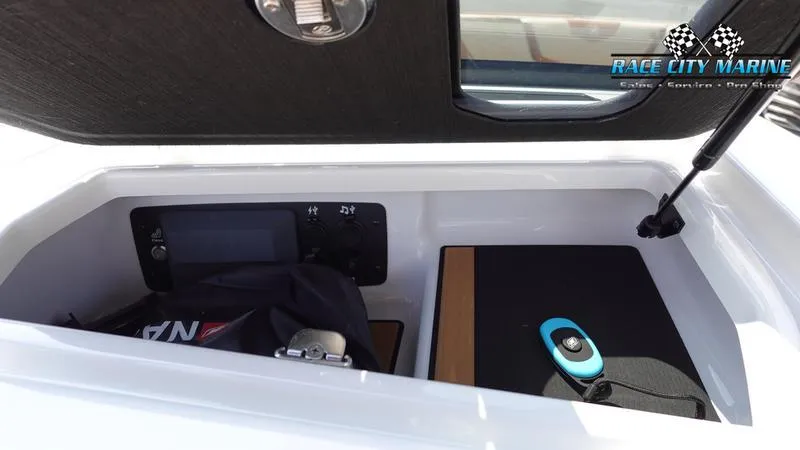 Slide: The Image of Storage compartment in 2022 Nautique Super Air Nautique G23 boat. - 11