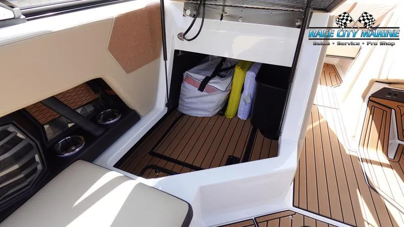 Slide: The Image of Interior of 2022 Nautique Super Air Nautique G23 with storage area. - 12