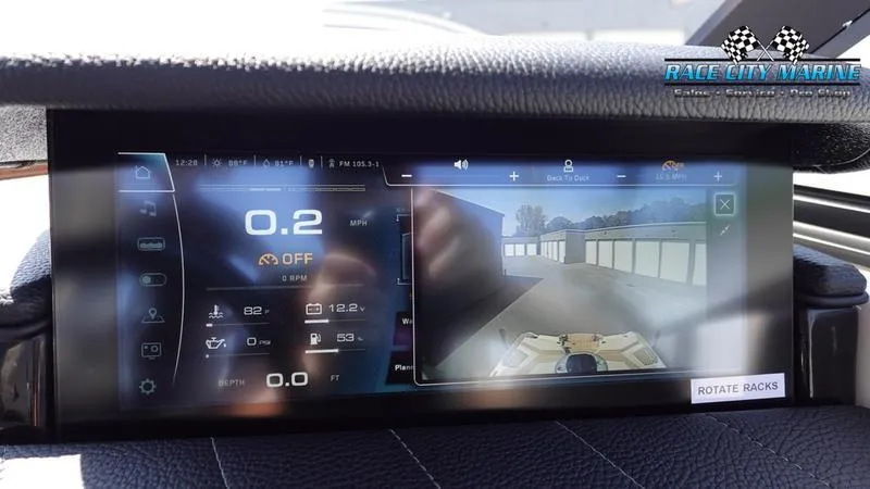 Slide: The Image of 2022 Nautique Super Air G23 dashboard with rearview camera. - 18