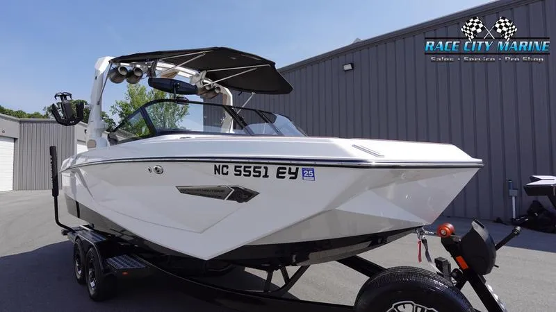 Slide: The Image of 2022 Nautique Super Air Nautique G23 boat on trailer. - 2