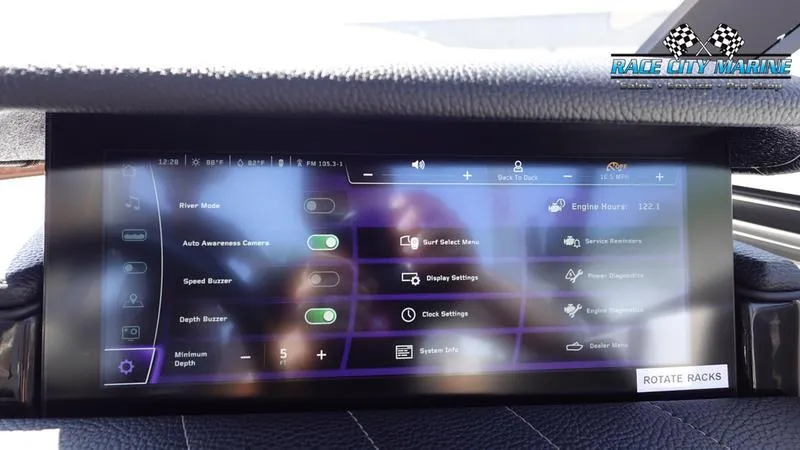 Slide: The Image of 2022 Nautique Super Air G23 touchscreen display with control options. - 21