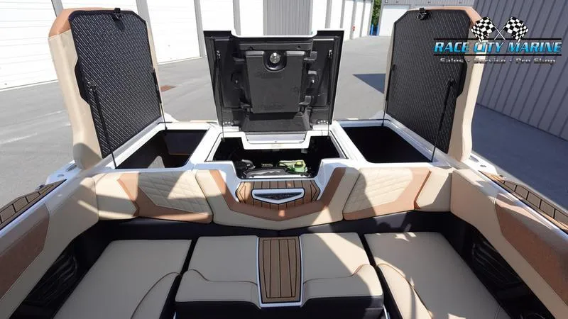 Slide: The Image of Interior of 2022 Nautique Super Air Nautique G23 with open storage compartments. - 25