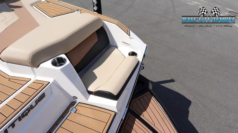 Slide: The Image of 2022 Nautique Super Air G23 boat rear seating area. - 26