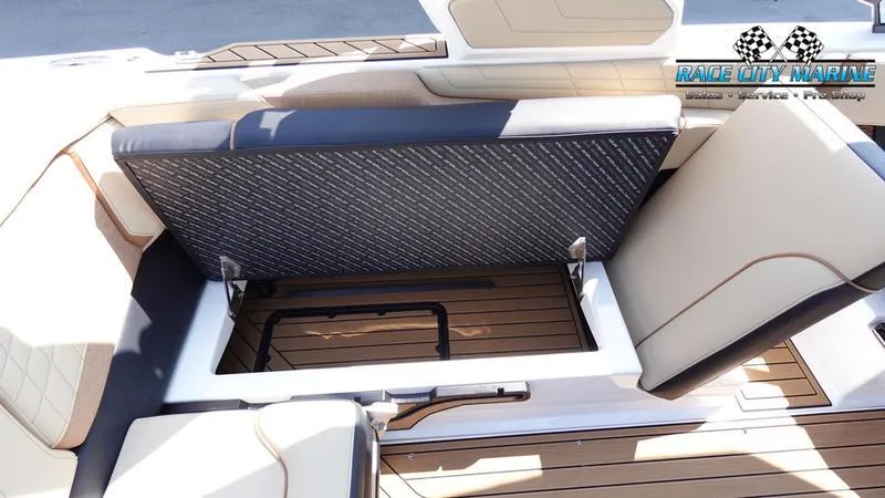 Slide: The Image of Interior of 2022 Nautique Super Air Nautique G23 with seating and storage area. - 38