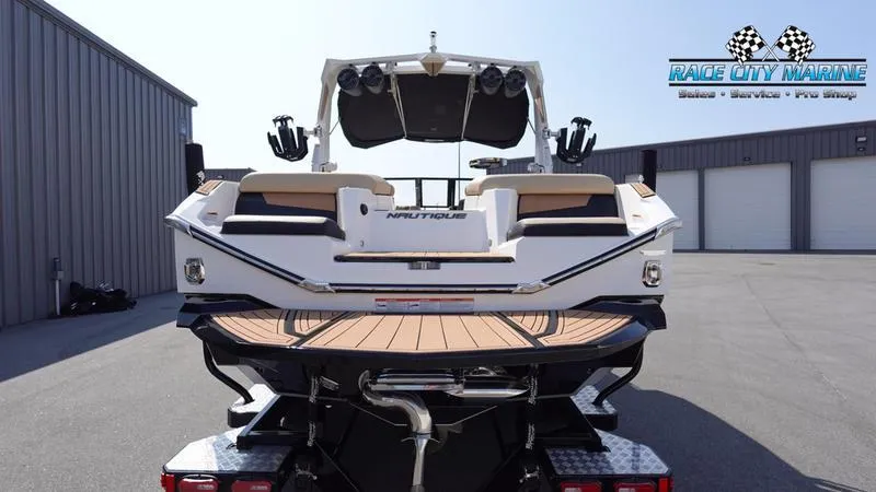 Slide: The Image of Rear view of a 2022 Nautique Super Air Nautique G23 boat. - 4
