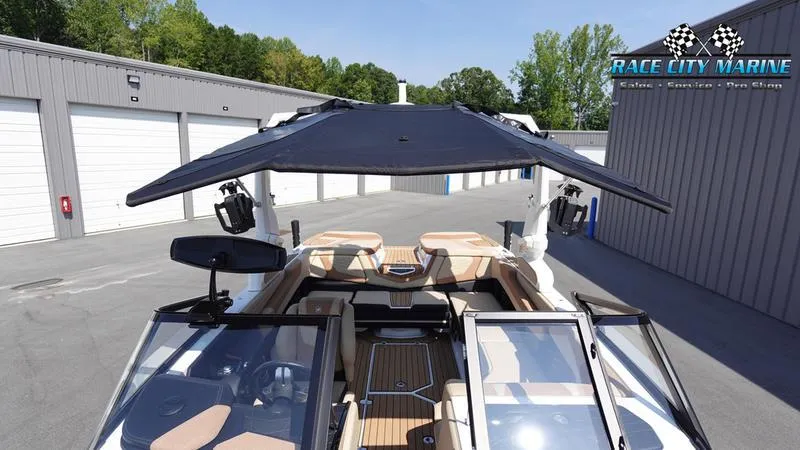 Slide: The Image of 2022 Nautique Super Air Nautique G23 boat with sunshade. - 9