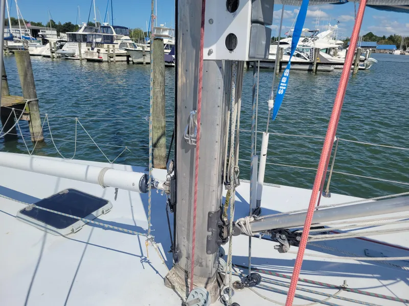 Slide: The Image of 1990 Nelson Marek IOR 50 racing sailboat mast and rigging at marina. - 11