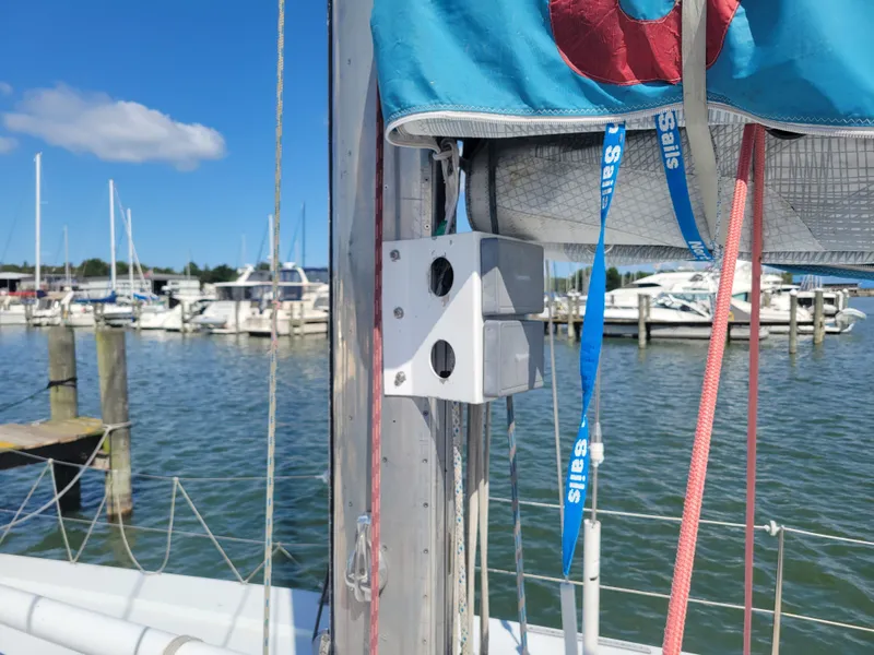 Slide: The Image of Nelson Marek IOR 50 sailboat mast with marina background, 1990 model. - 12