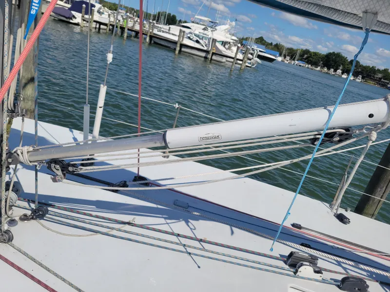 Slide: The Image of Nelson Marek IOR 50 Racing Sailboat deck with rigging, docked at marina, 1990 model. - 14