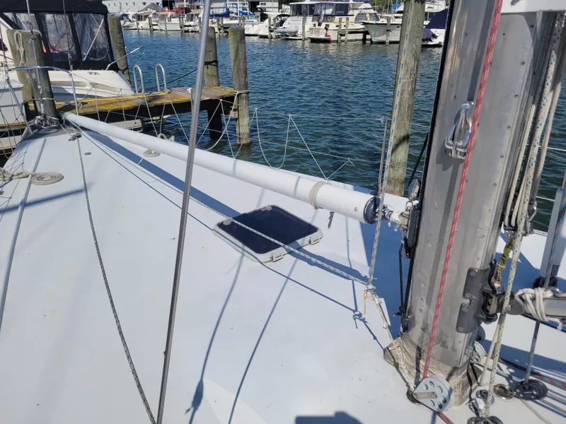 Slide: The Image of Nelson Marek IOR 50 Racing Sailboat, 1990, docked at marina with visible rigging and mast. - 15