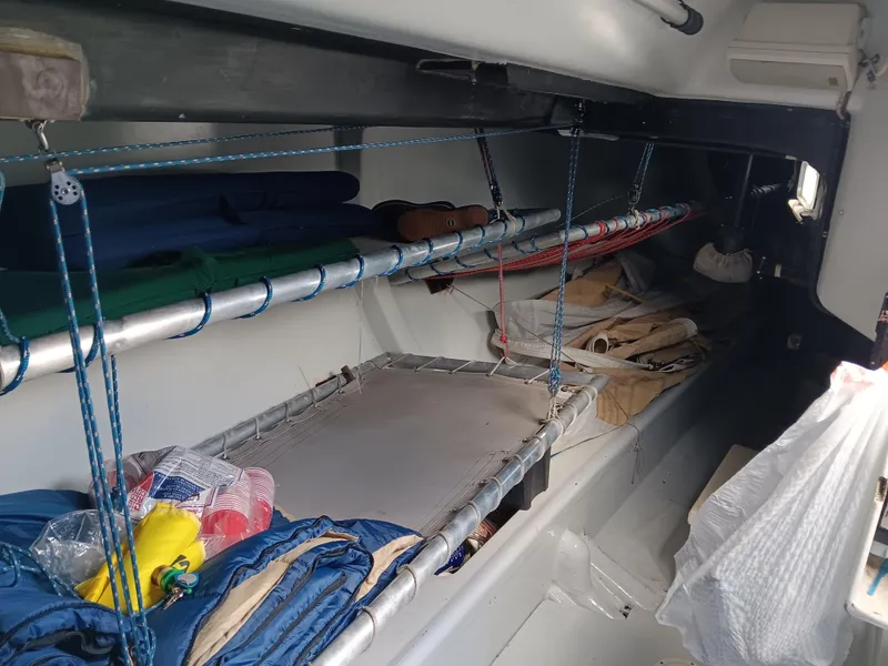 Slide: The Image of Interior of a 1990 Nelson Marek IOR 50 racing sailboat with storage and bunks. - 18