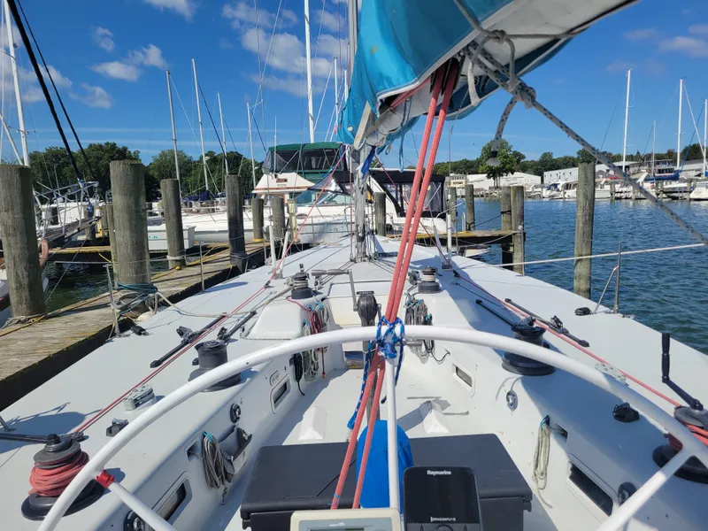 Slide: The Image of Nelson Marek IOR 50 racing sailboat docked at marina, clear sky, 1990 model. - 5