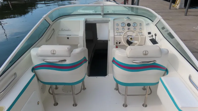 Slide: The Image of Interior of a 1997 Envision Intruder 3200 boat with dual seats and control panel. - 5
