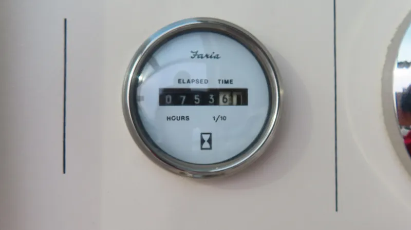 Slide: The Image of Faria elapsed time gauge showing 753.6 hours on a 1997 Envision Intruder 3200. - 8