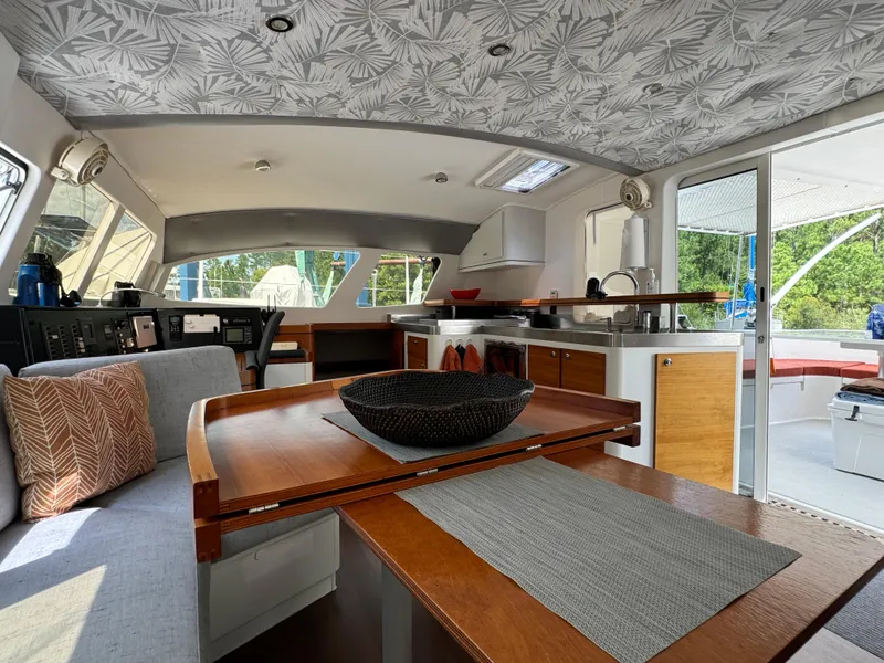 Slide: The Image of Interior of 2010 Outremer 49 catamaran with modern dining area and stylish decor. - 12