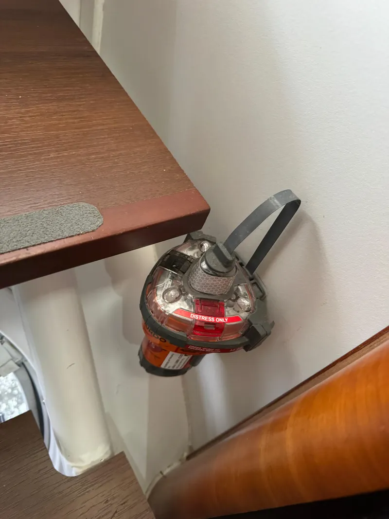 Slide: The Image of Emergency beacon mounted on a wall inside a 2010 Outremer 49 yacht. - 22