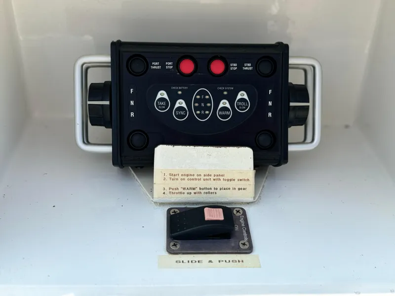 Slide: The Image of Control panel of a 2010 Outremer 49 sailboat with instructions and toggle switch. - 24