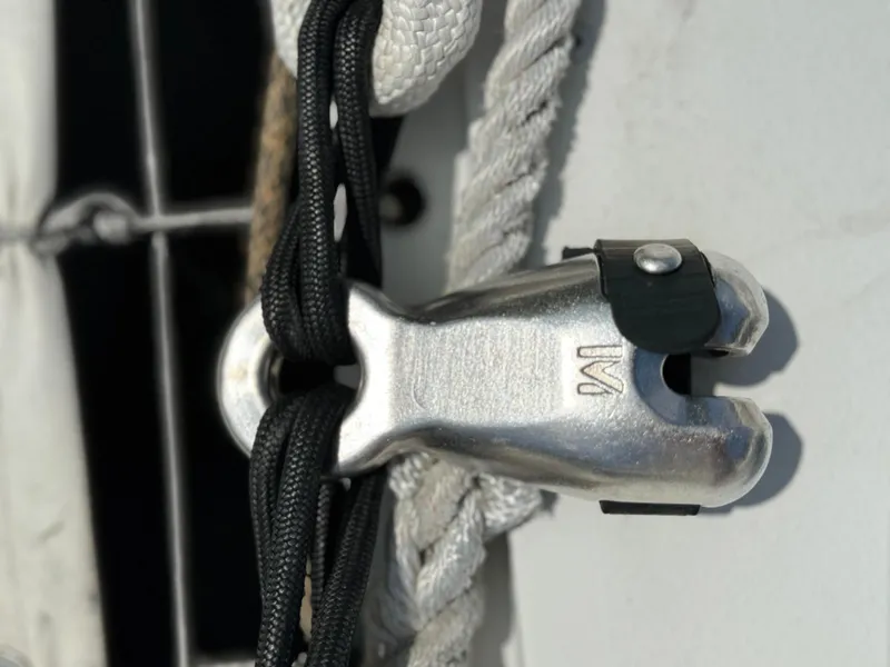 Slide: The Image of Close-up of a 2010 Outremer 49 sailboat rigging component with ropes. - 31