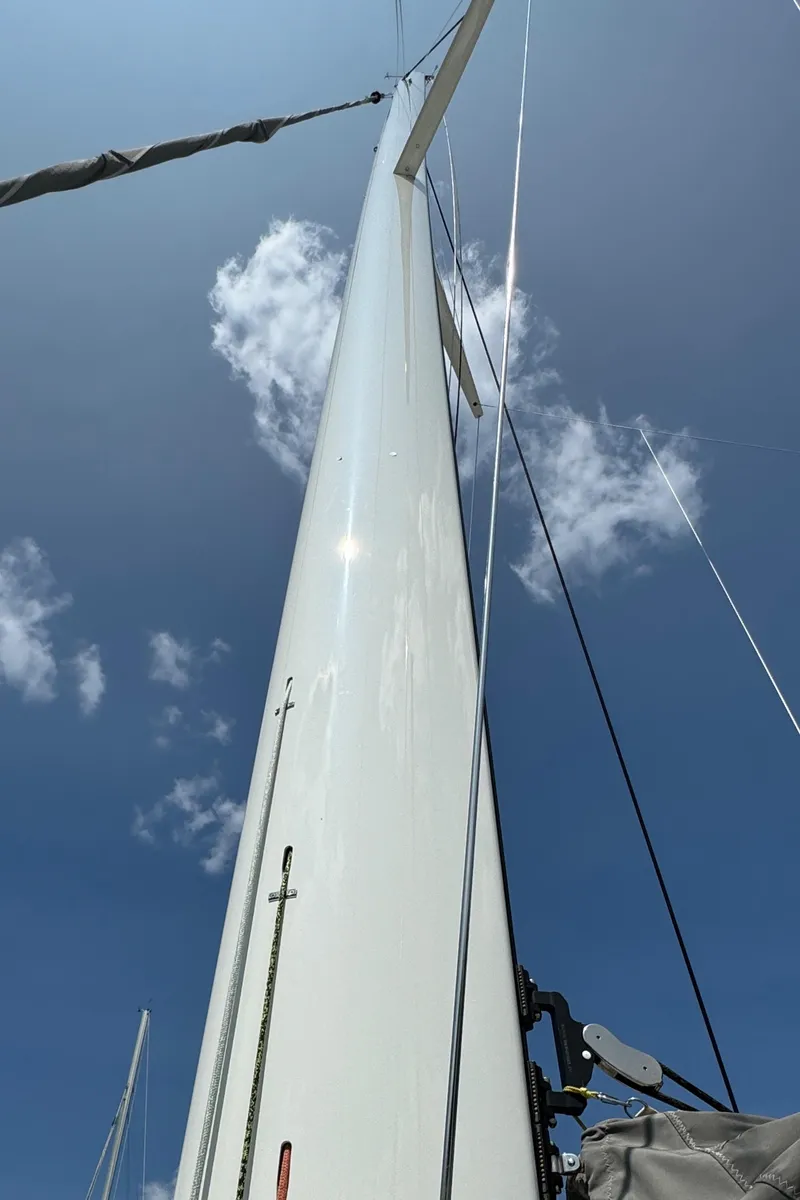 Slide: The Image of Sailboat mast of 2010 Outremer 49 against a clear blue sky. - 46