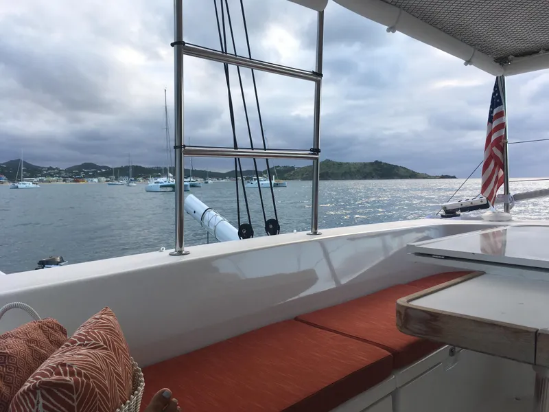 Slide: The Image of View from 2010 Outremer 49 sailboat, featuring ocean and distant islands under cloudy skies. - 7