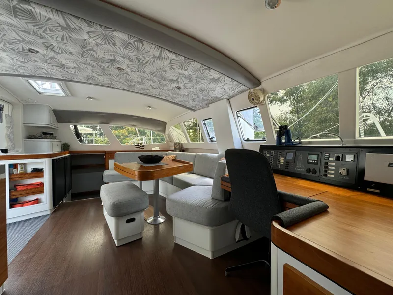 Slide: The Image of Spacious interior of 2010 Outremer 49 catamaran with modern seating and navigation area. - 8