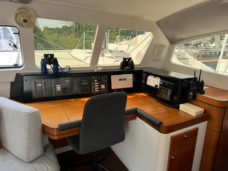 Slide: The Image of Navigation station of a 2010 Outremer 49 yacht with control panels and equipment. - 9