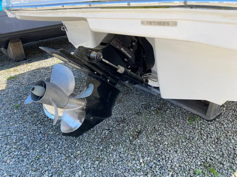 Slide: The Image of 2019 Chaparral 246 SSi boat propeller on gravel surface. - 10