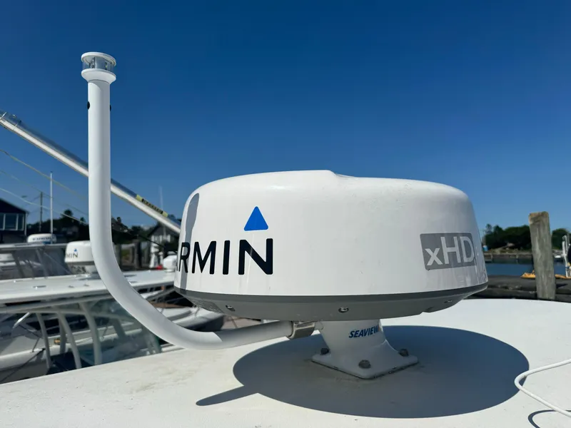 Slide: The Image of Garmin xHD radar on 2009 Regulator 32 Forward Seating boat under clear blue sky. - 10