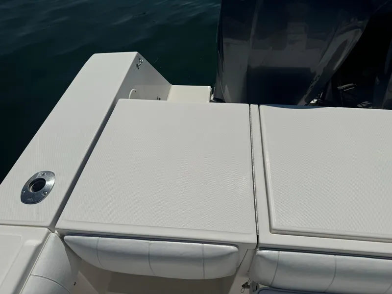 Slide: The Image of 2009 Regulator 32 Forward Seating boat, rear deck view with cushioned seating. - 14